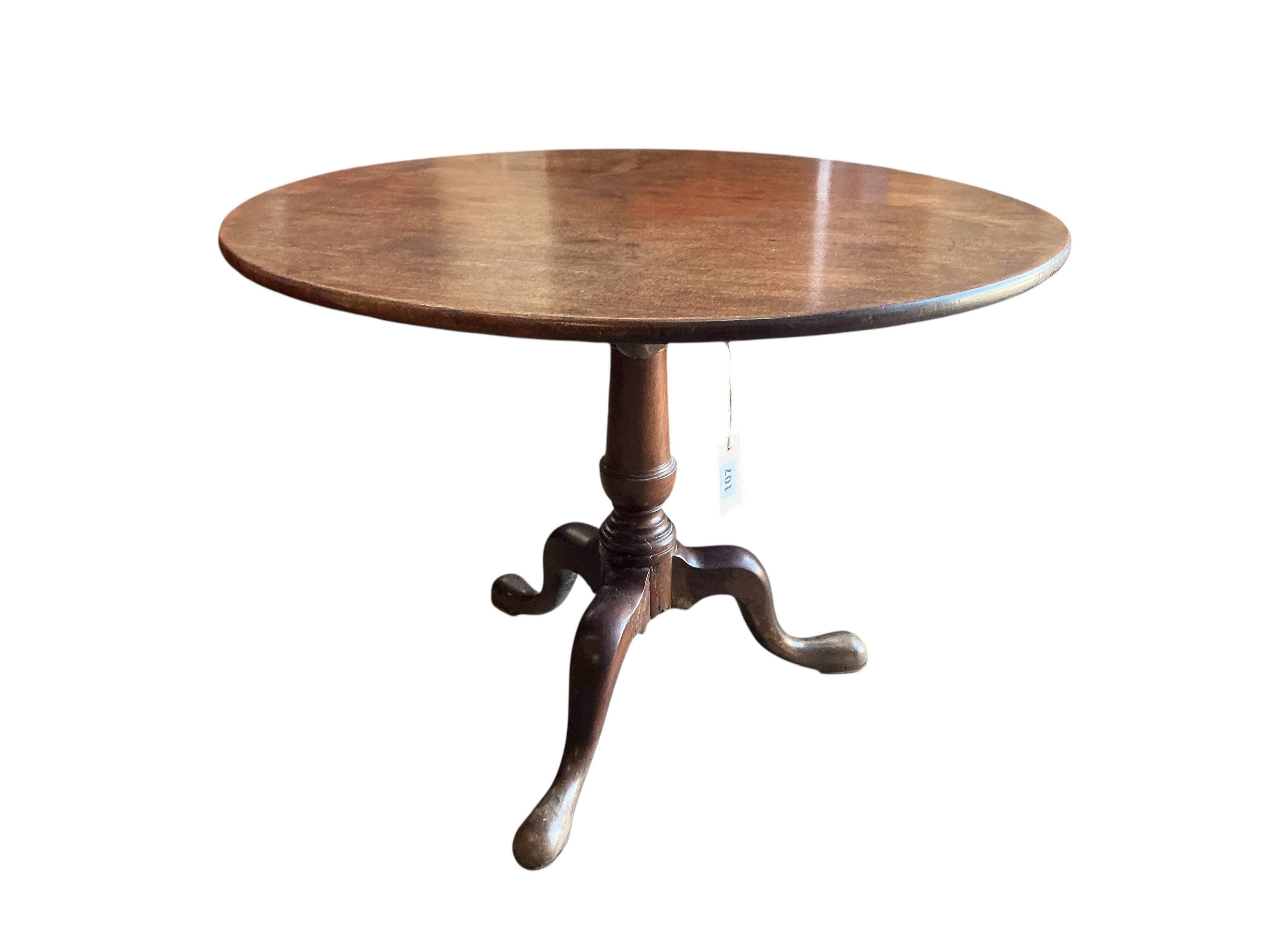 A George III circular mahogany tilt top tripod tea table, diameter 91cm, height 72cm